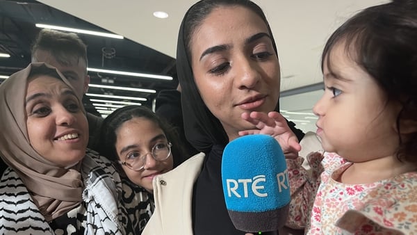 Nisreen Abuowda (L) and her daughter Sara (R) with family members after arriving at Dublin Airport