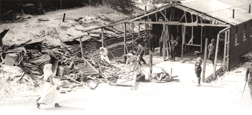 Canadian nursing sisters search through the rubble after their quarters was bombed. [PHOTO: ARCHIVES OF ONTARIO—C224-0-0-10-48]