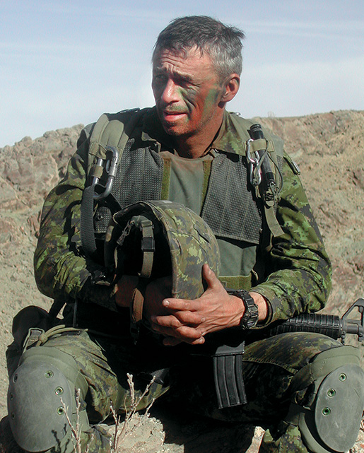Stogran takes a breather during Operation Apollo in Afghanistan in 2002. [STEPHEN J. THORNE]